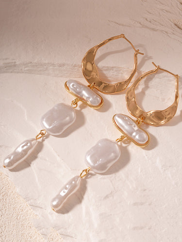 Geometrisches Accessoires mit Quastenohrringen