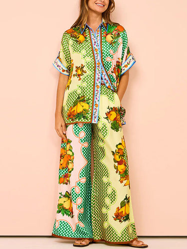 Top e pantaloni a tappe con stampato floreale con le maniche corte a maniche corte e pantaloni due pezzi