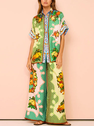 Top e pantaloni a tappe con stampato floreale con le maniche corte a maniche corte e pantaloni due pezzi