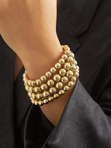Accesorios de brazalete de color sólido con cuentas