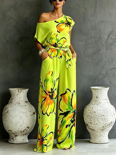 1781545 Loose Short Sleeves Contrast Color Flower Print Knot Pockets Tied Waist One-Shoulder Jumpsuits
