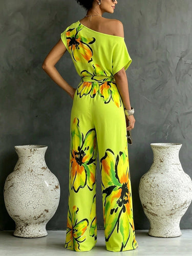 1781546 Loose Short Sleeves Contrast Color Flower Print Knot Pockets Tied Waist One-Shoulder Jumpsuits